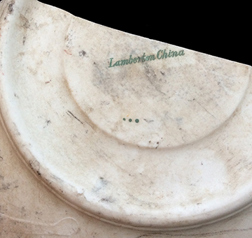 Cup and Saucer. Unglazed bisque waster. Painted band and decal decoration. Decal mark “Lamberton China” on underside of saucer. Cup diameter: 3.5”; Cup thickness: 2.6 mm; Saucer diameter:  6.25”; Saucer thickness 3.7 mm.